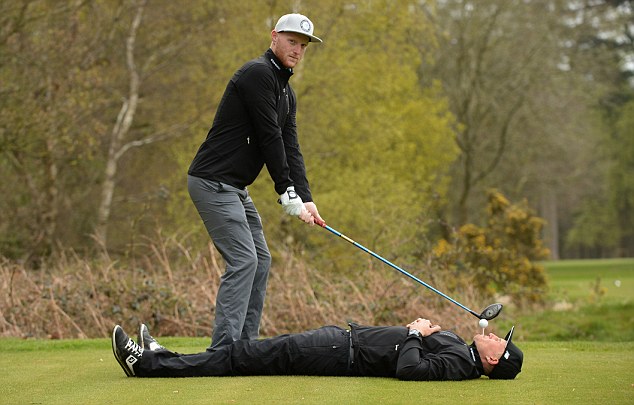 Golfers teeing off