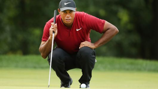 Tiger Woods looking at the ball